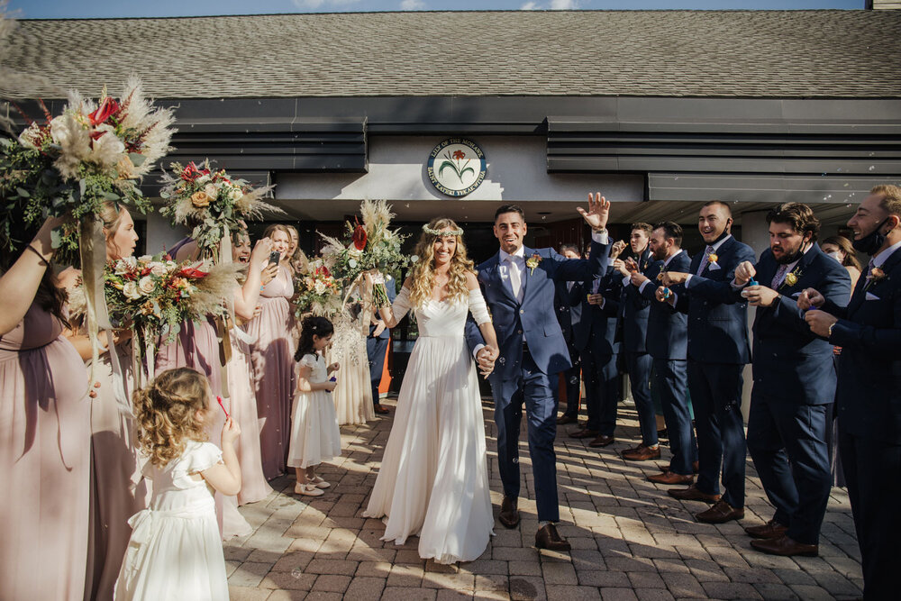 bride and groom during a grand exit at the church