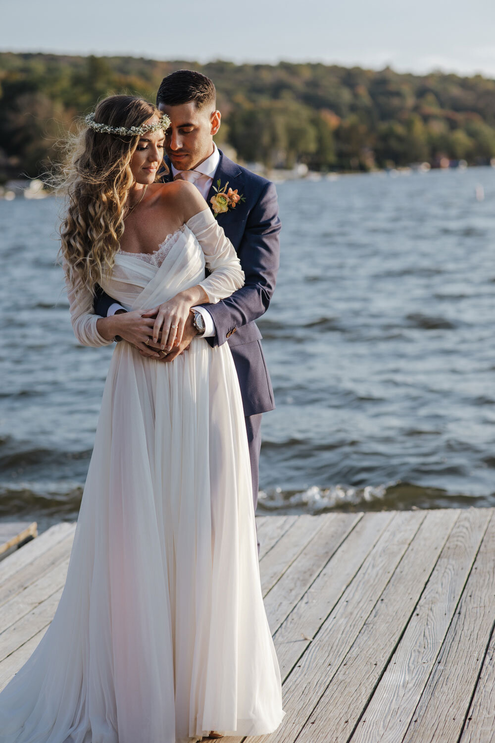 a bride and groom on the dock at Lake Mohawk Country Club