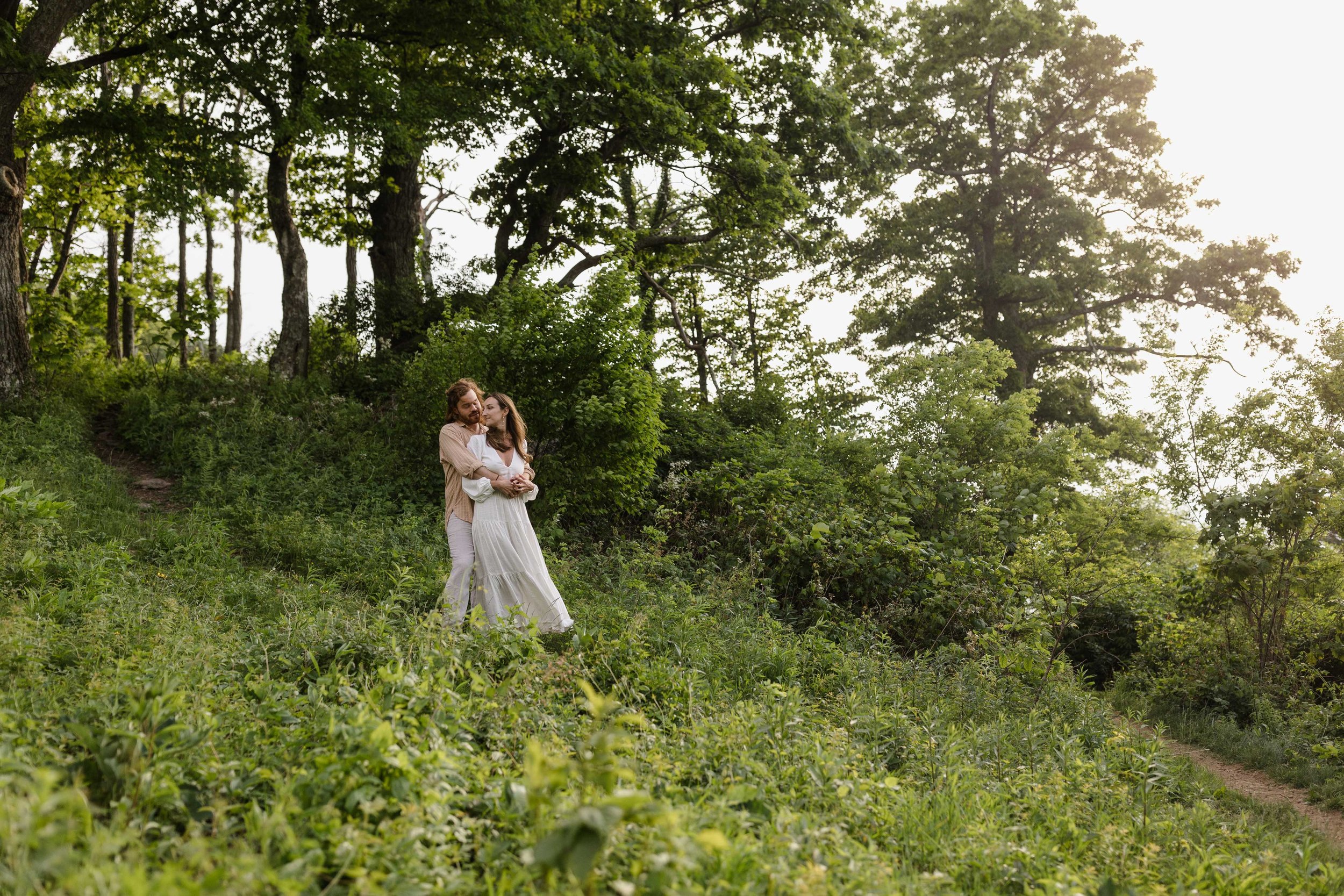 Couple embracing during an engagement session at Shenandoah National Park