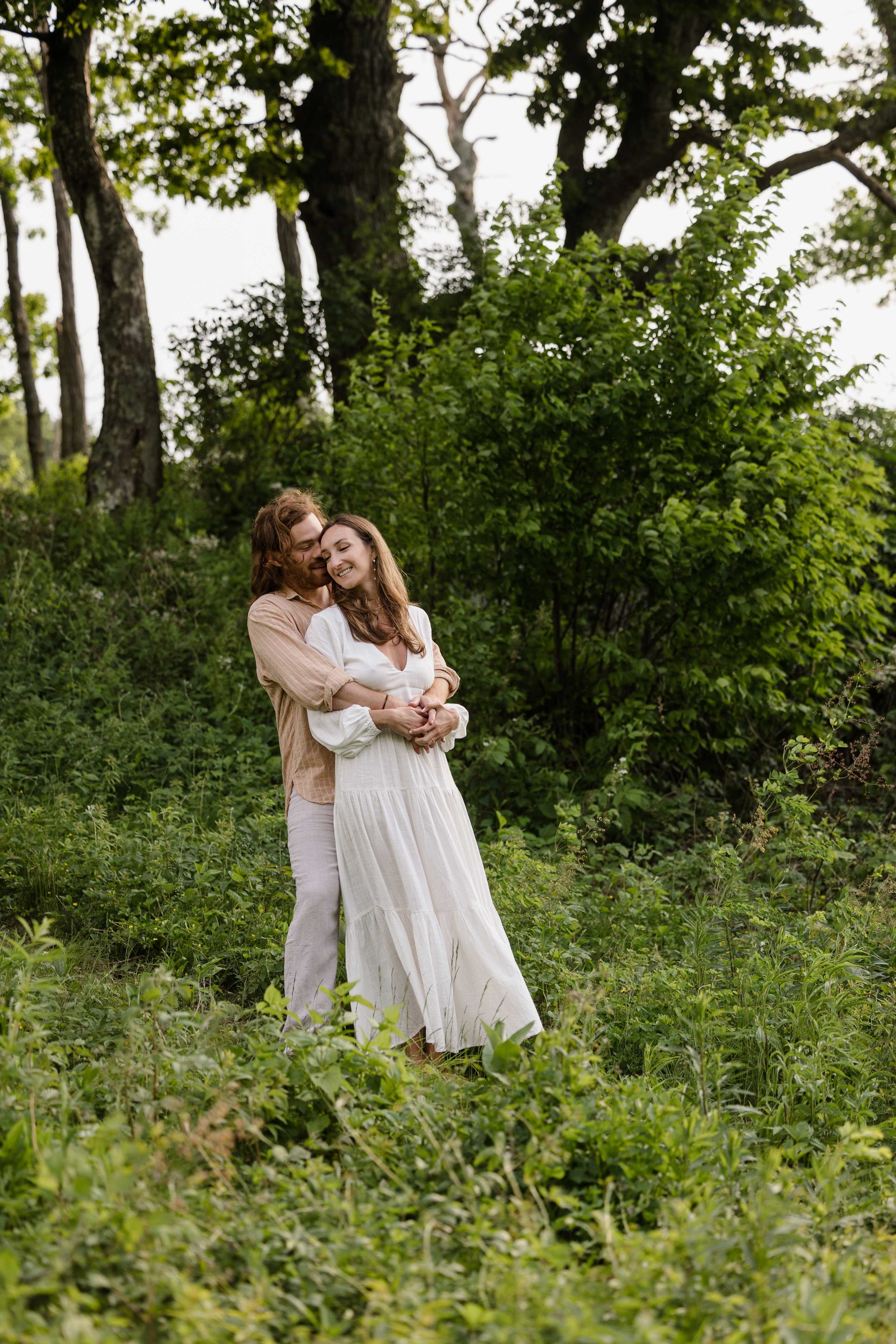 Engaged couple being photographed at Shenandoah National Park
