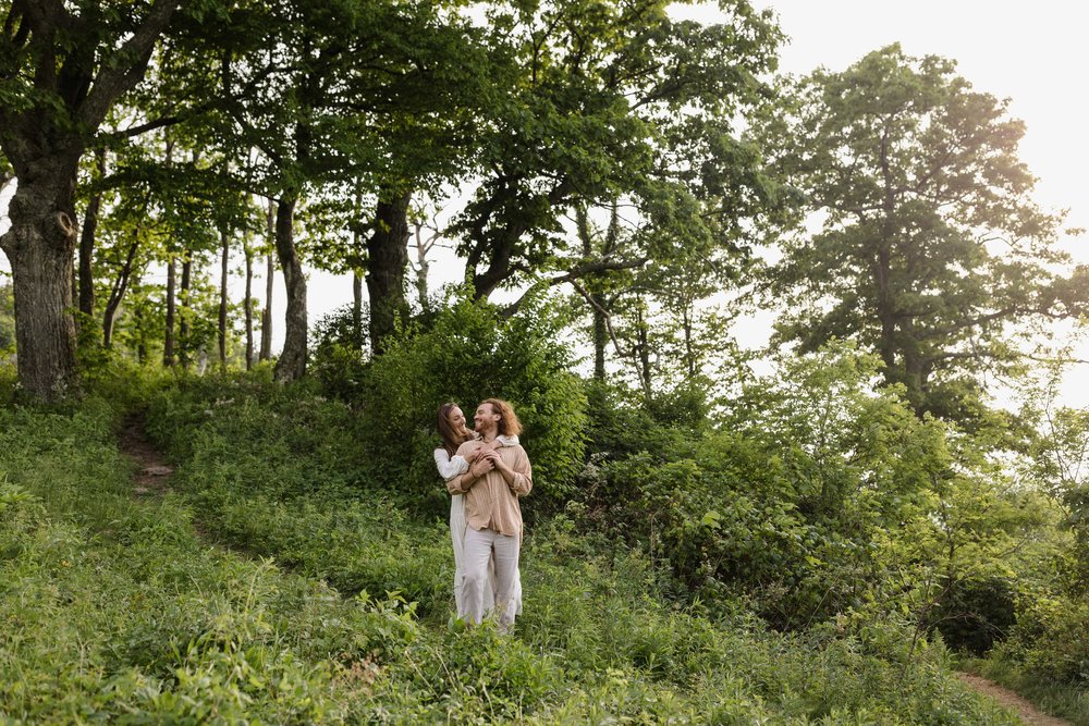 Engaged couple being photographed at Shenandoah National Park