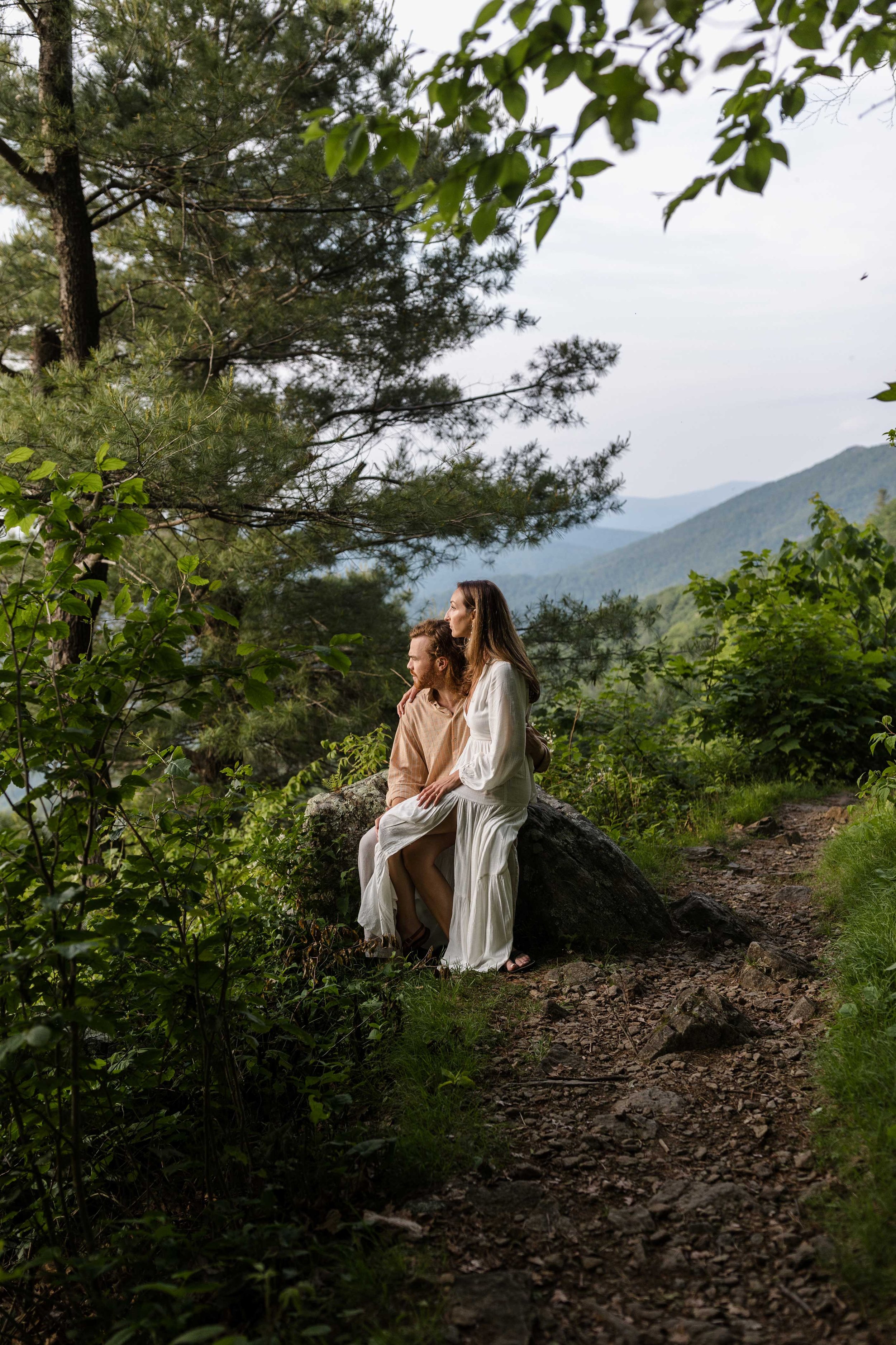 Couple sitting on a rock at Jewell Hollow Overlook in Shenandoah National Park