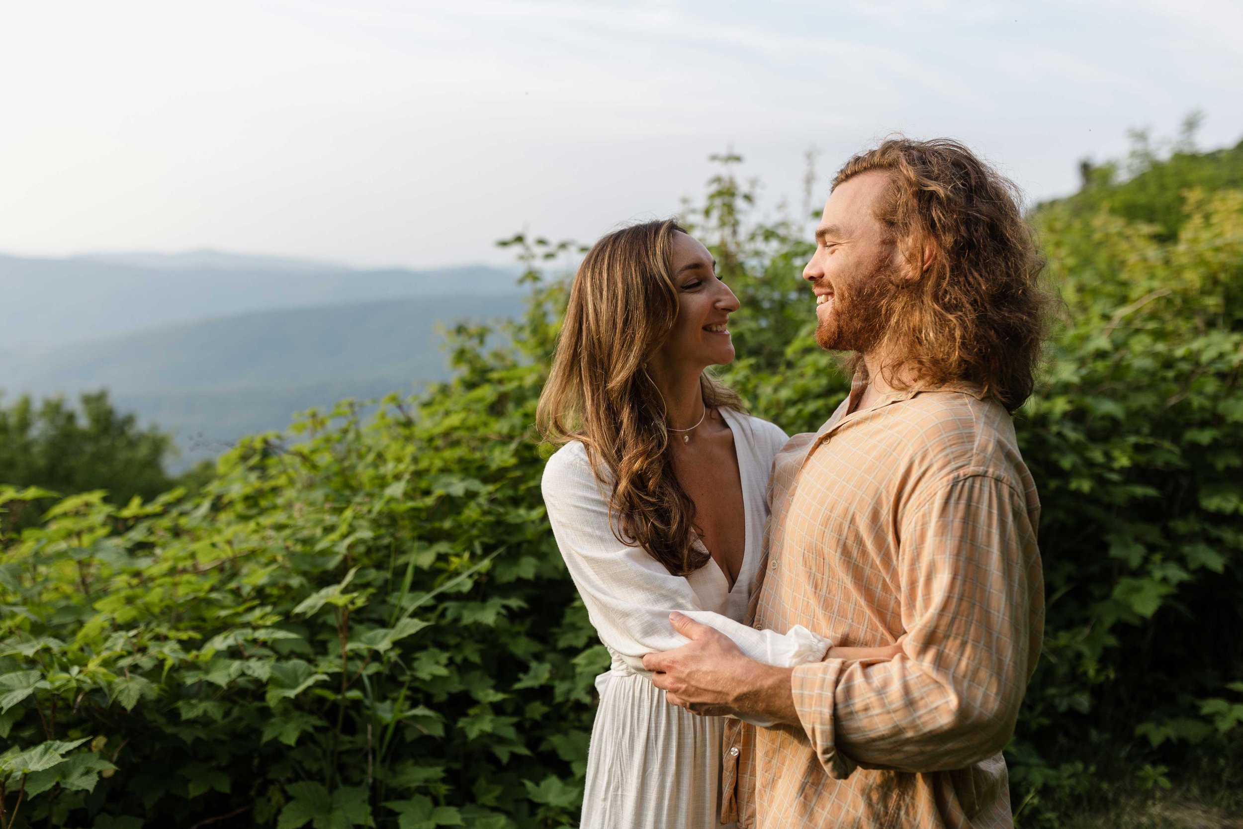 Engaged couple being photographed at Shenandoah National Park