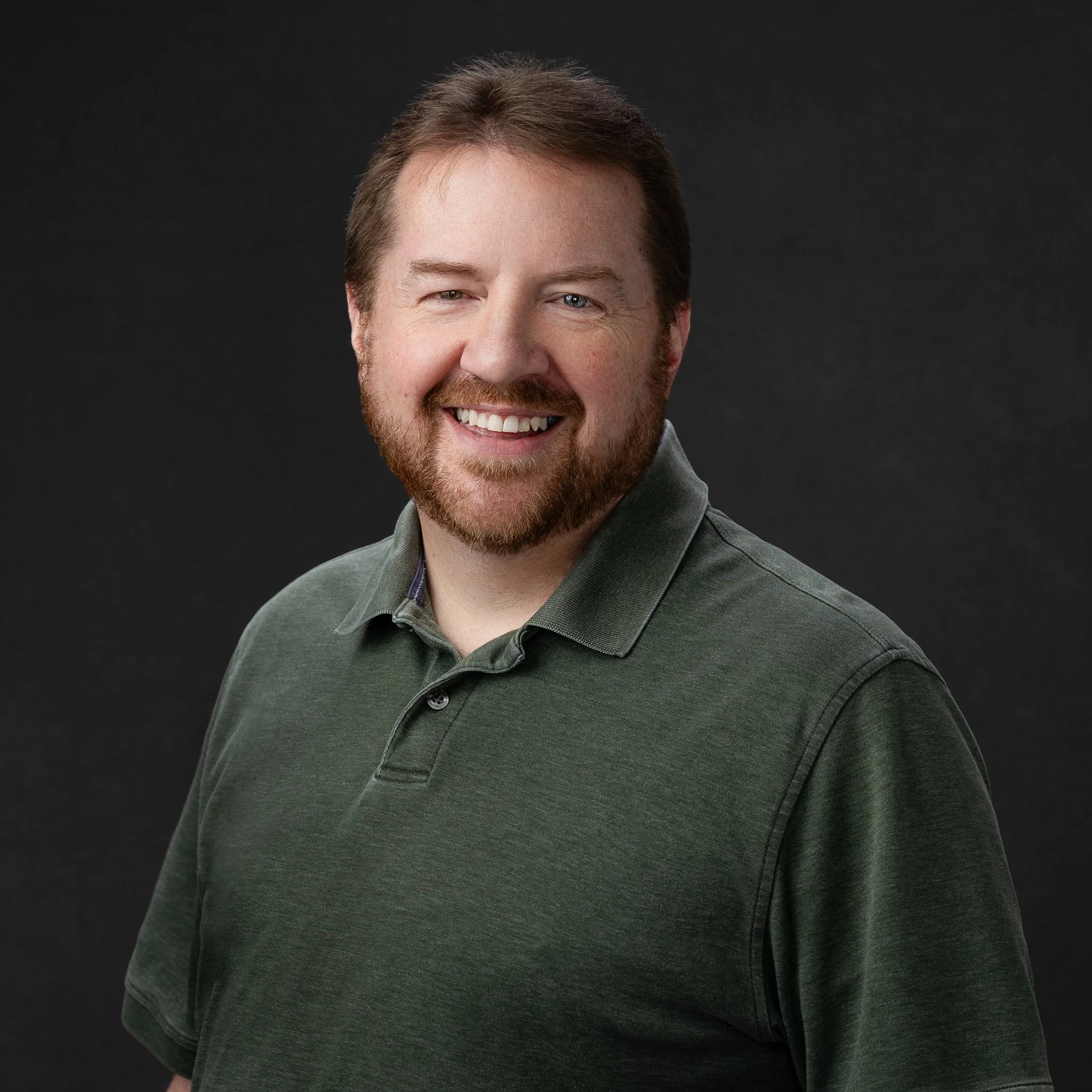 Professional headshot of a Boise businessman on a dark gray background
