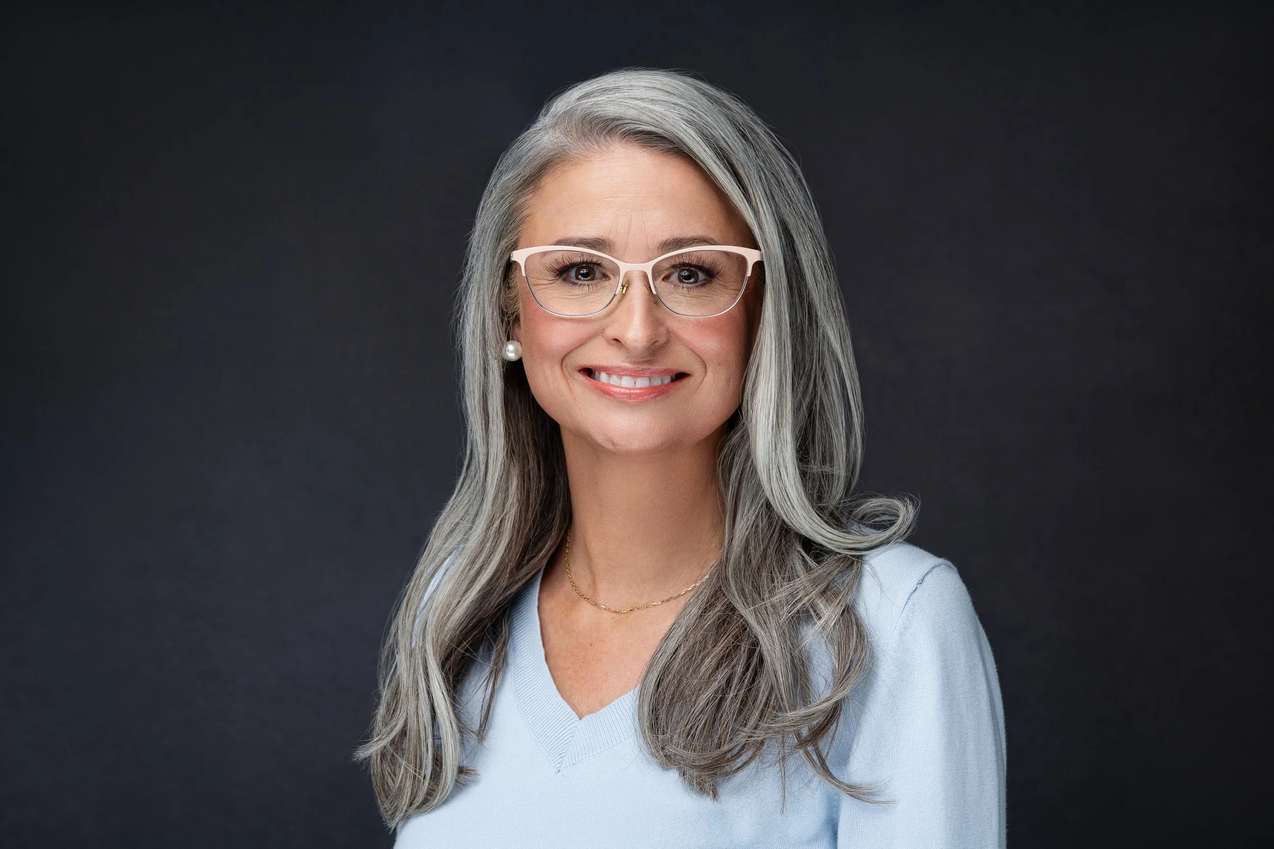 headshot wearing glasses