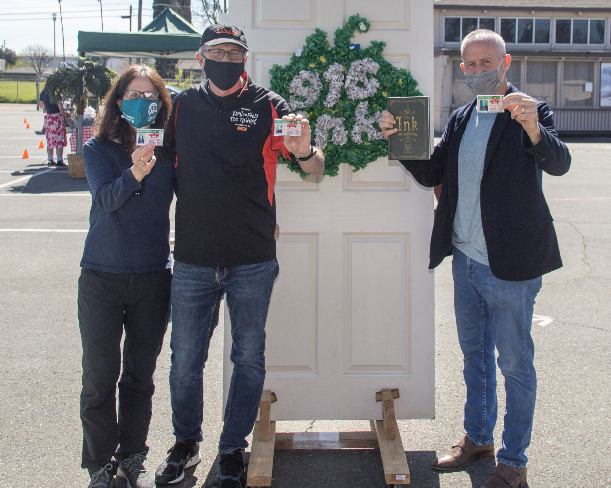 Mayor Darrell Steinberg, Councilmember Jay Schenirer, and Bina Lefkovitz pose with their brand-new "Poetic Licenses."