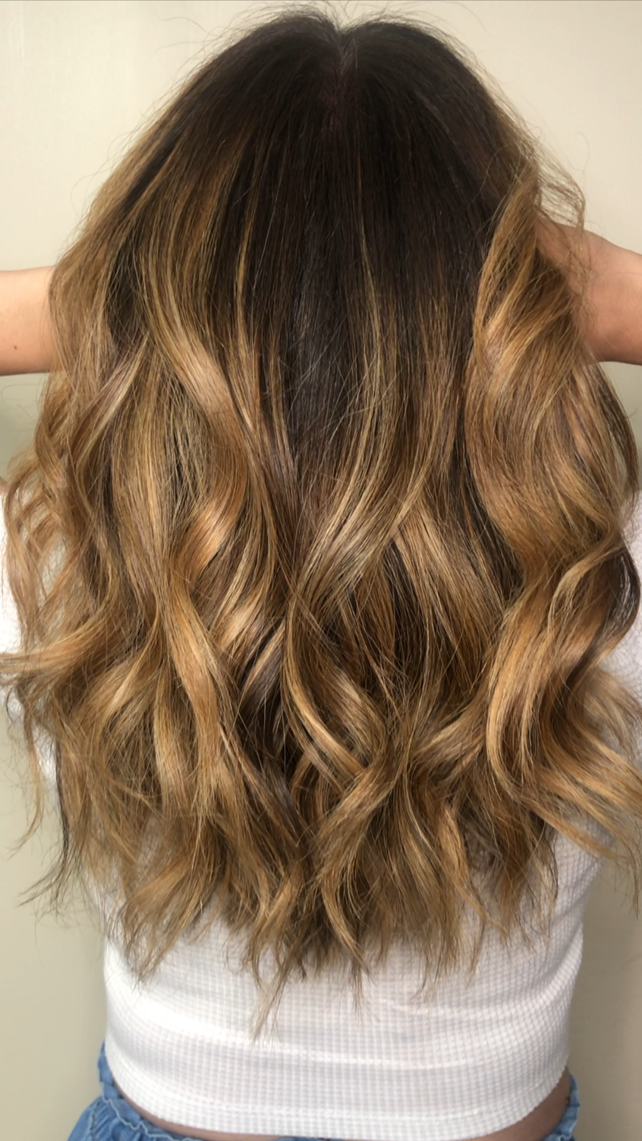Curly brunette color with soft movement