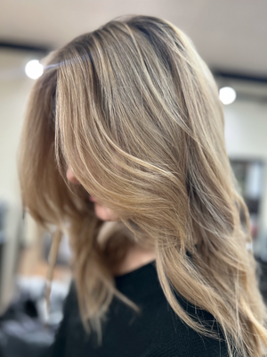 Dimensional blonde hair color by Kanika Styles