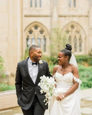 Bride and groom walking after ceremony at National Cathedral