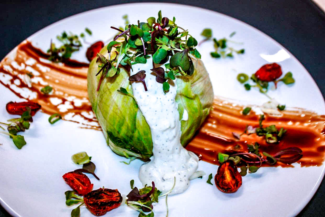 “The Dome,” a mini-head of iceberg stuffed with bacon, caramelized onions, blue cheese and oven dried tomatoes.
