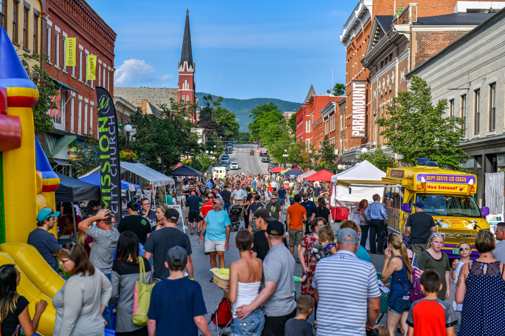 A crowd full of people on Center Street enjoy games, music, food and more in Downtown Rutland at Friday Night Live on July 13th, 2018.