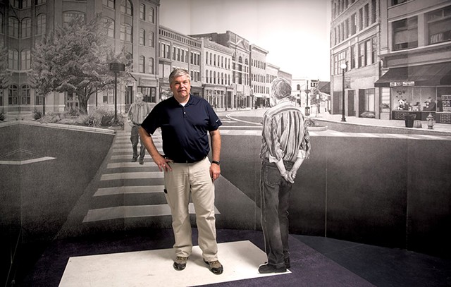 Mark Foley stands in front of Bill Ramage’s ‘Rutland Drawing” in the Opera House on Merchants Row. Photo by Seven Days staff photographer Caleb Kenna.