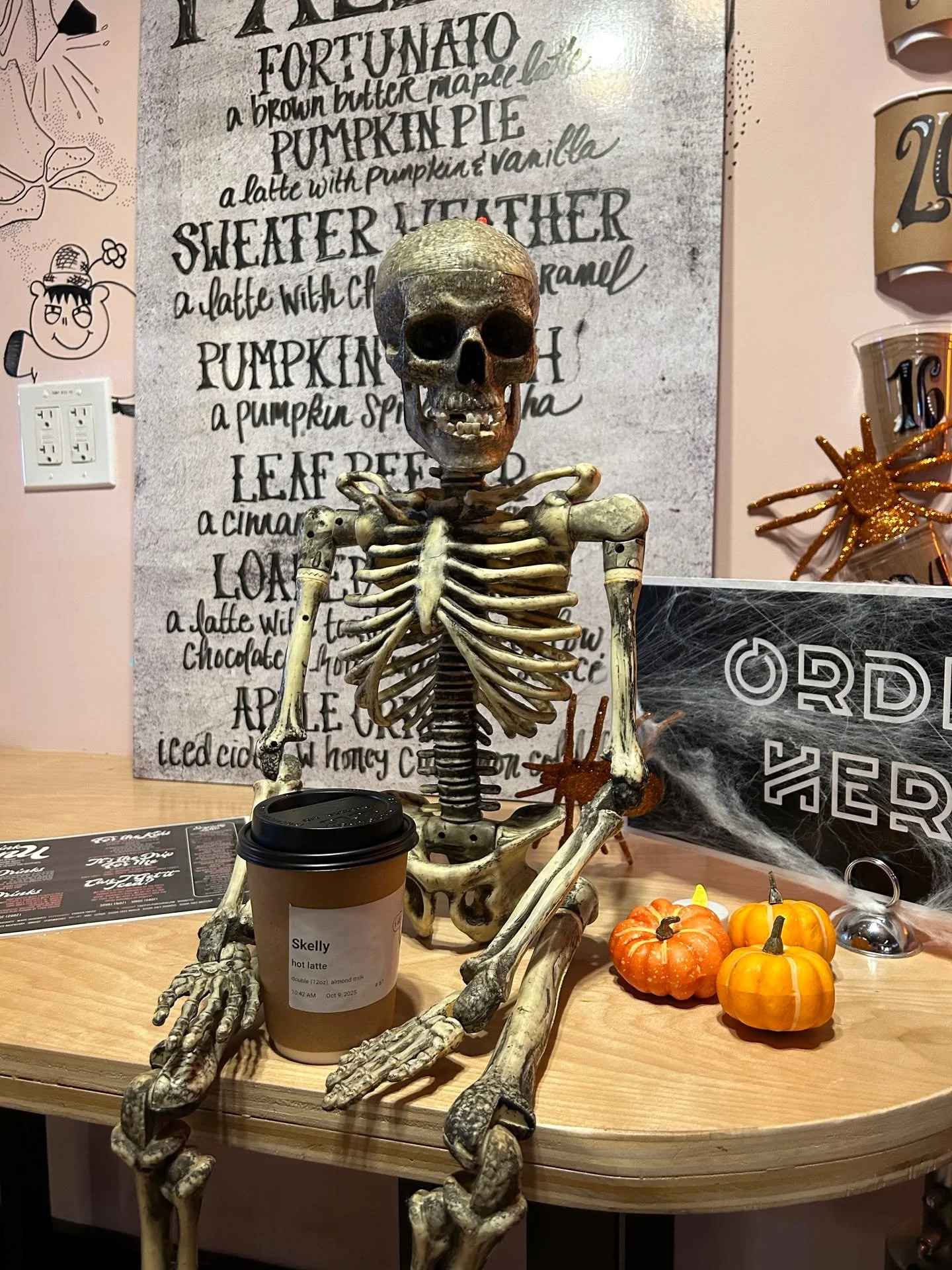 Meet Skelly, a skeleton eager for adventure! Today, he chose to enjoy a cozy afternoon at the Spook-easy Caf&eacute;. As he sipped his coffee, he couldn't help but admire the quirky d&eacute;cor under the soft glow of ghostly lights...

But be carefu
