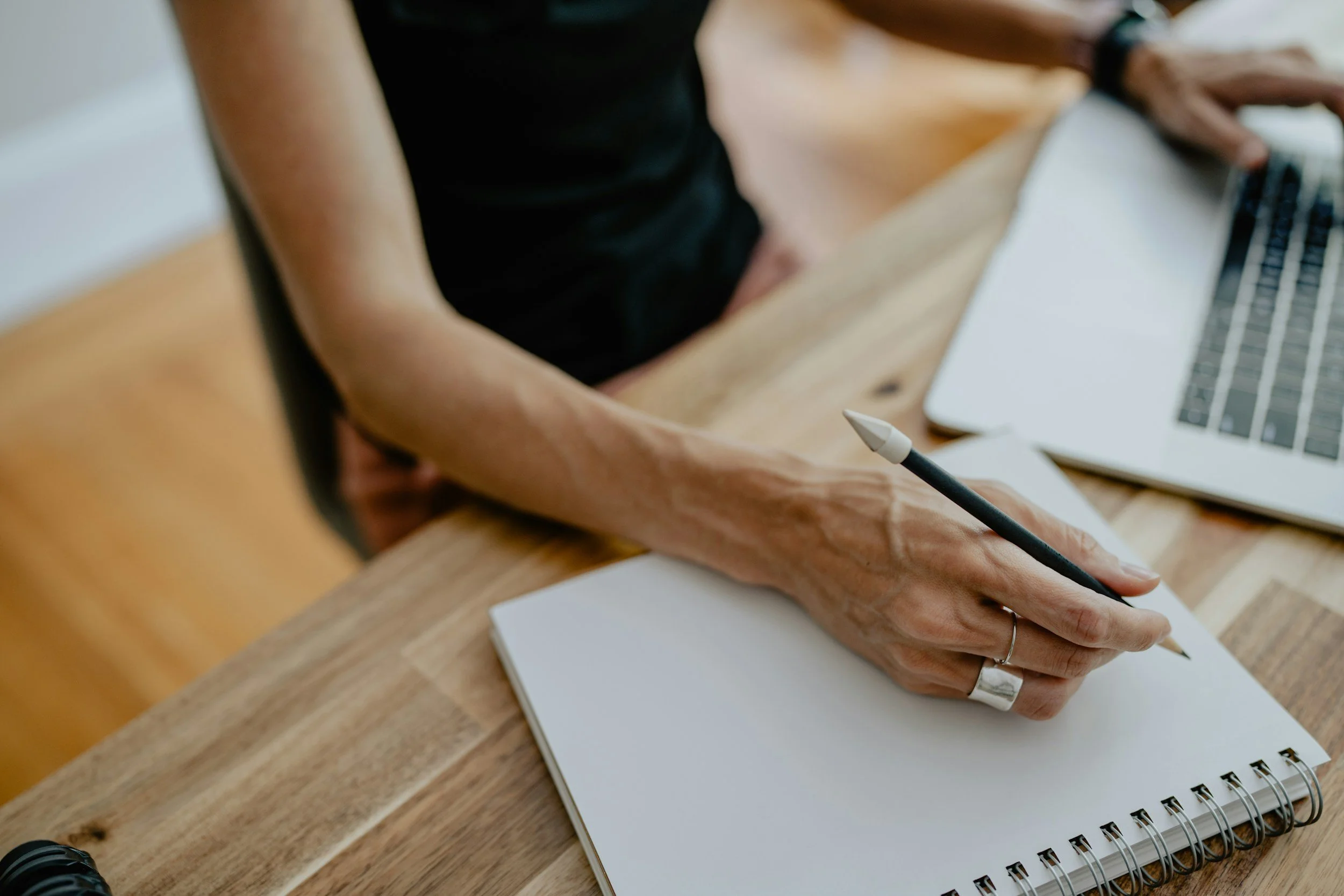 acupuncturist taking notes during initial fertility appointment