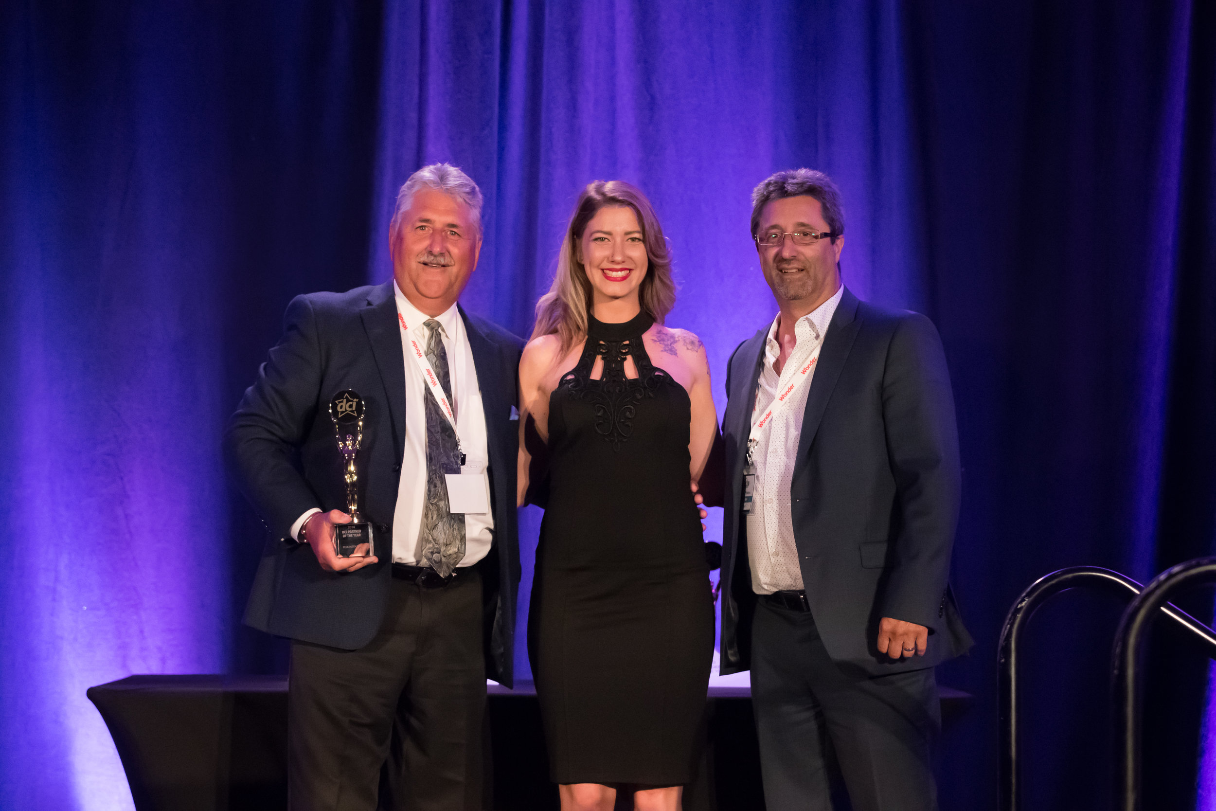 Greg McGrath (Left) and Mike Medeiros (Right) Pose With Star Awards Presenter (Centre)