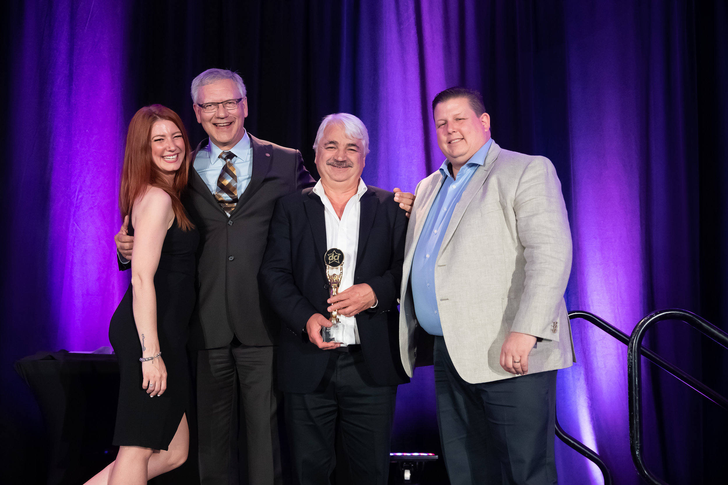 Star Awards Presenter Melissa Lynne-Schaffer, DCI Past Chair Dave Powell of Atlantic Grocery Distributors, Jim Bexis of Sun Valley Market and Barry Lanteigne of DCI