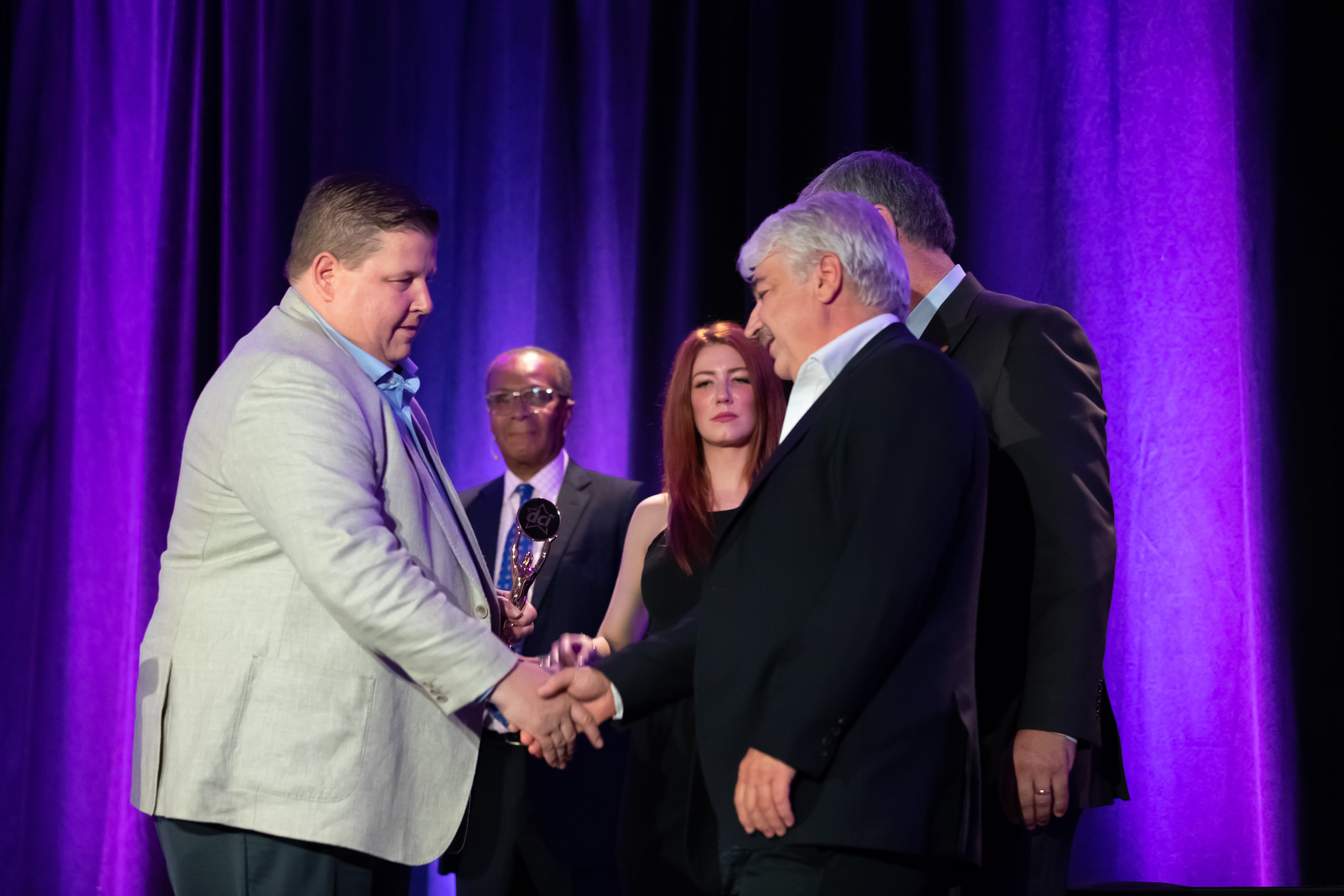 Barry Lanteigne of DCI shakes hands with Jim Bexis of Sun Valley Market