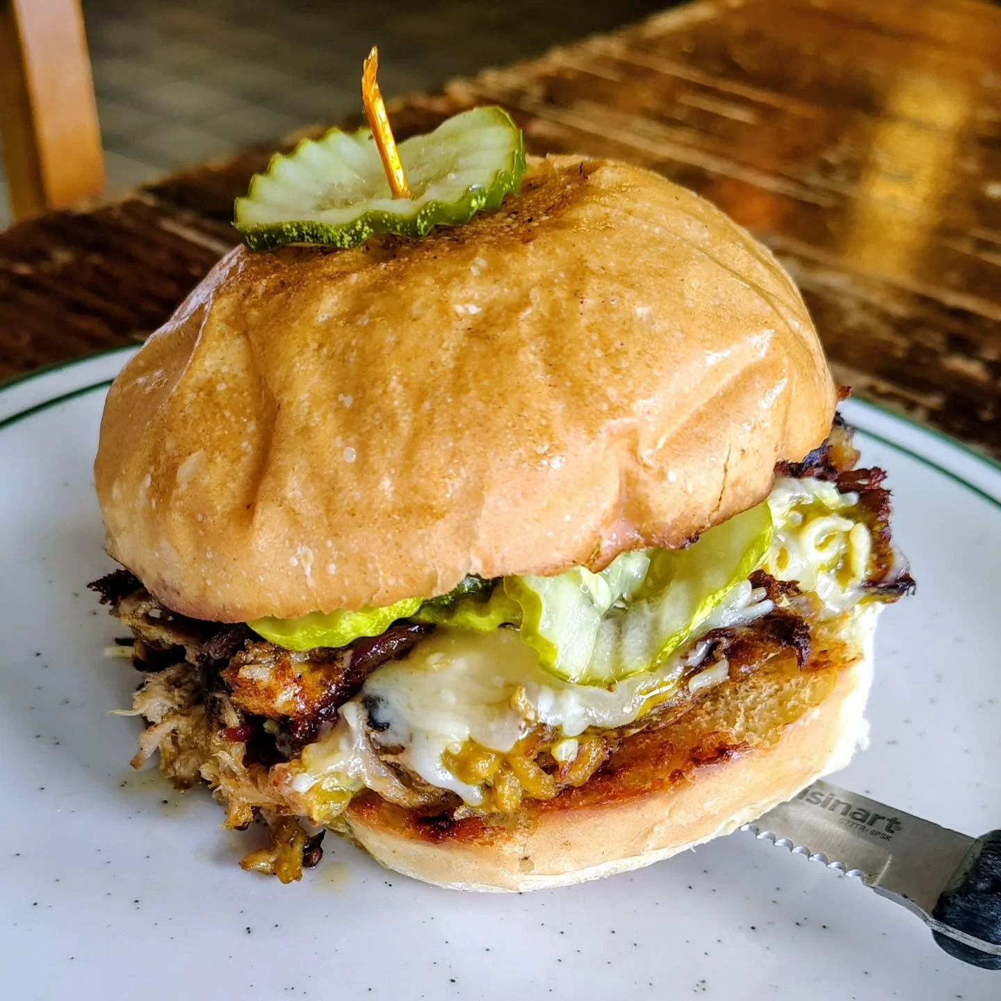 Special pulled pork sandwich!! 
Slow roasted pulled pork shoulder, smoked gruyere and caramelized onion jack cheese, Carolina Gold BBQ sauce, petite arugula, grilled onions and pickles on a toasted Kaiser roll