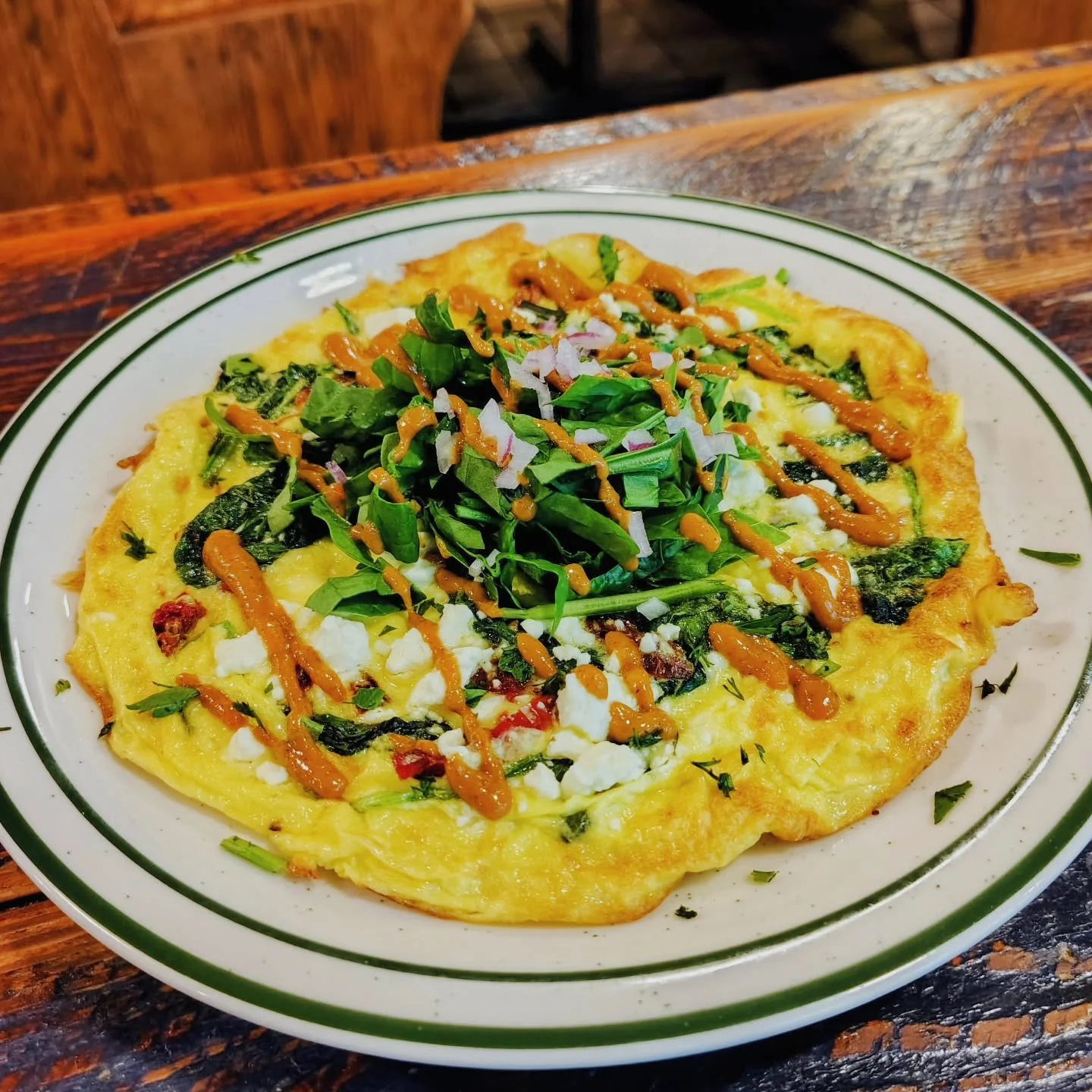 Frittata!!
Sun-dried tomatoes, sauteed spinach, creamy feta chz cheese topped with petite chopped spinach salad and a sun-dried tomato dressing.