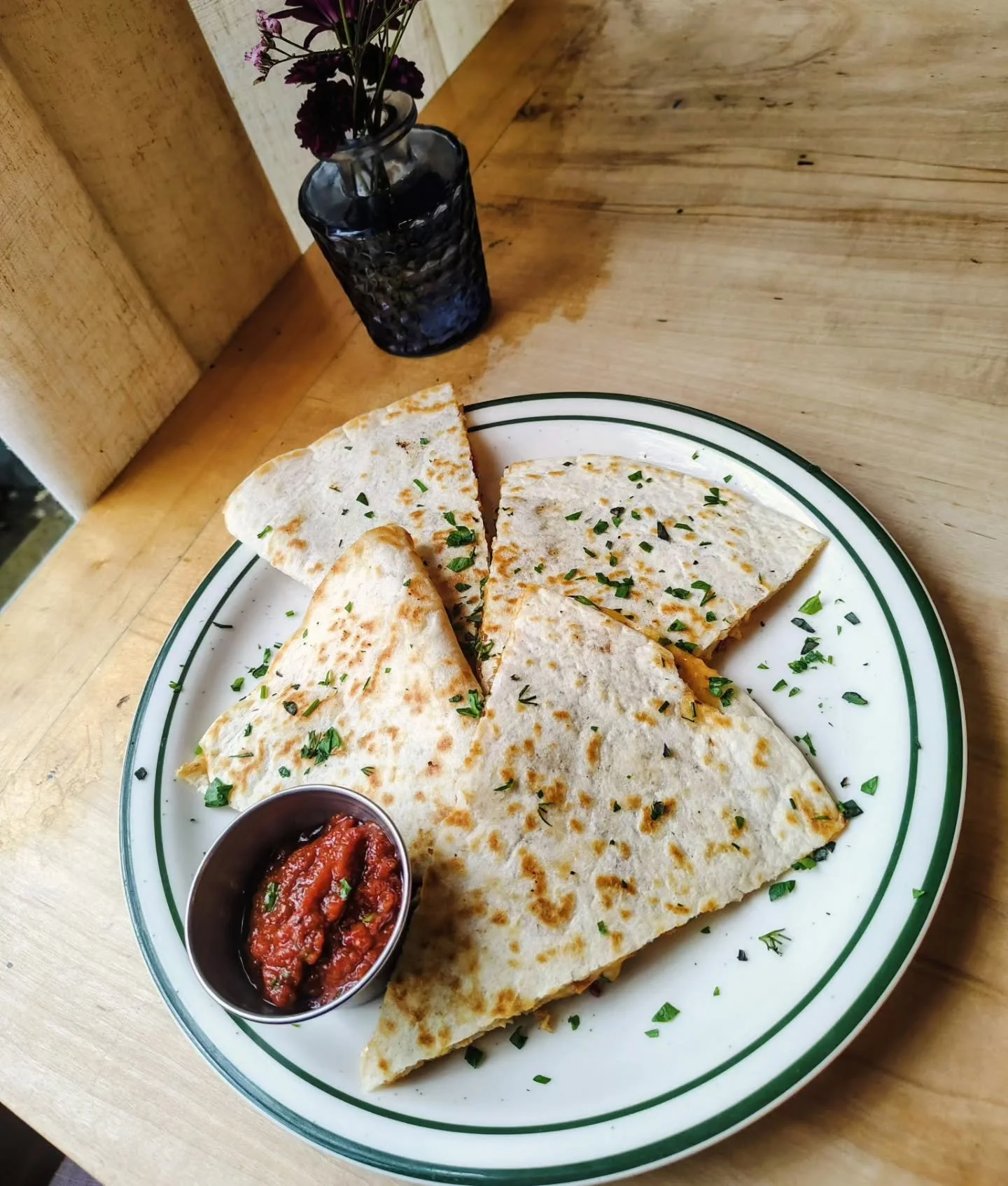 Shredded turkey quesadilla, seared shredded turkey, melted blend of 3 cheeses with caramelized onions fire roasted red peppers grilled mushrooms, creamy garlic chipotle sauce, served with house salsa.