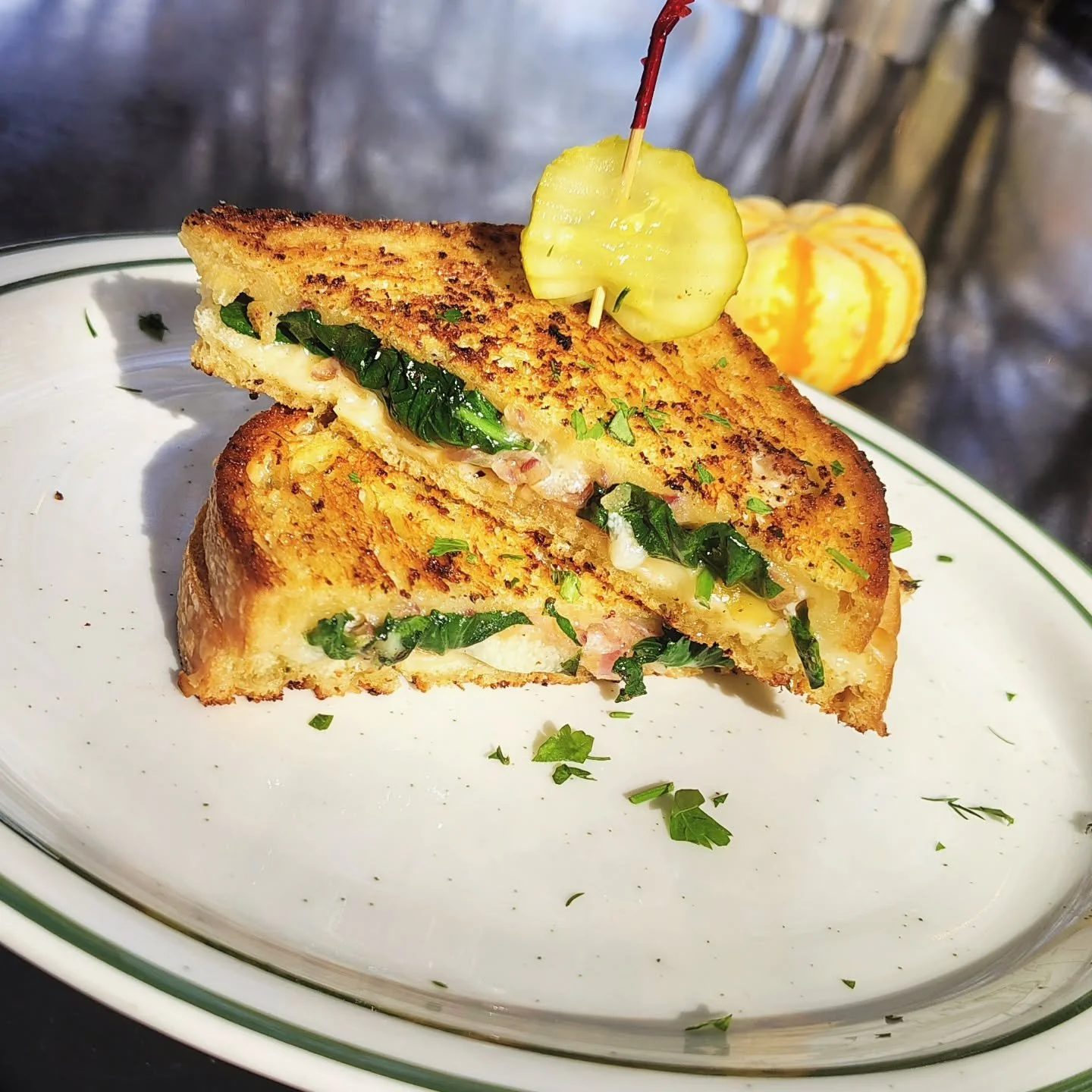 Special Grilled cheese, 
Melted Manchego and smoked Gruyere, sauteed spinach and onions, with garlic herb butter grilled sourdough toast.