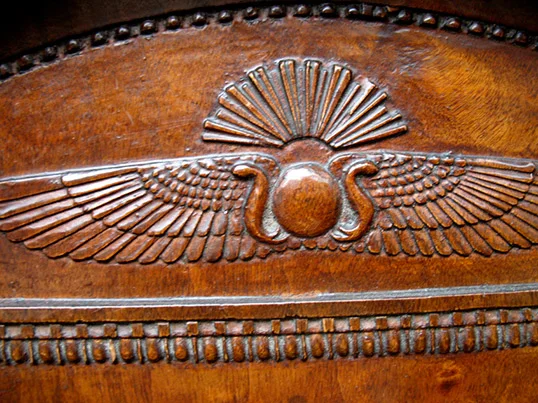 Winged Sun of Thebes flanked by Uraeus.