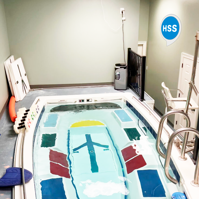 HSS pool with logo on the wall.png