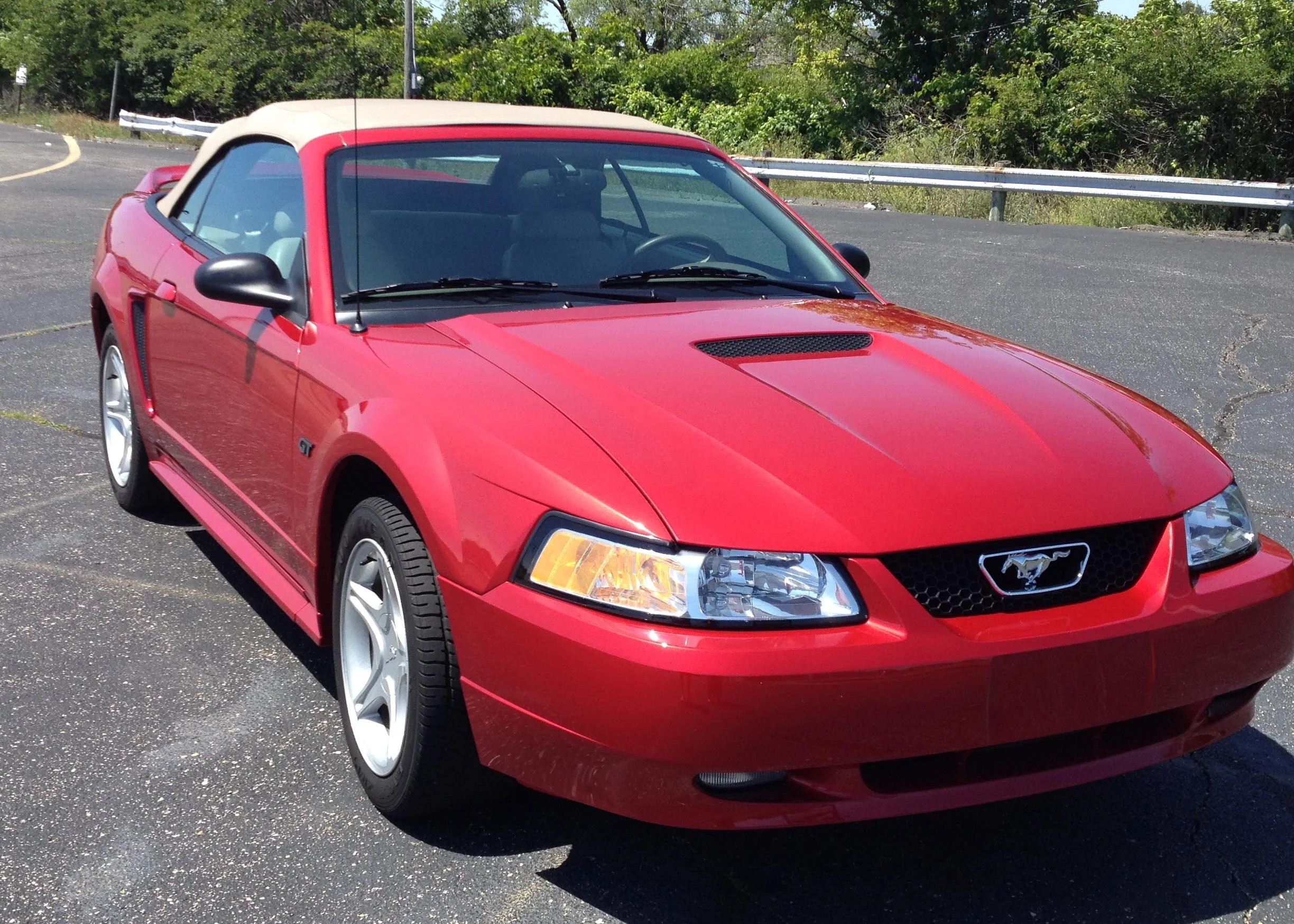 For Sale: 2000 Ford Mustang GT Convertible (Laser Red, tan soft top, 4.6L V8, auto trans, 12K miles)