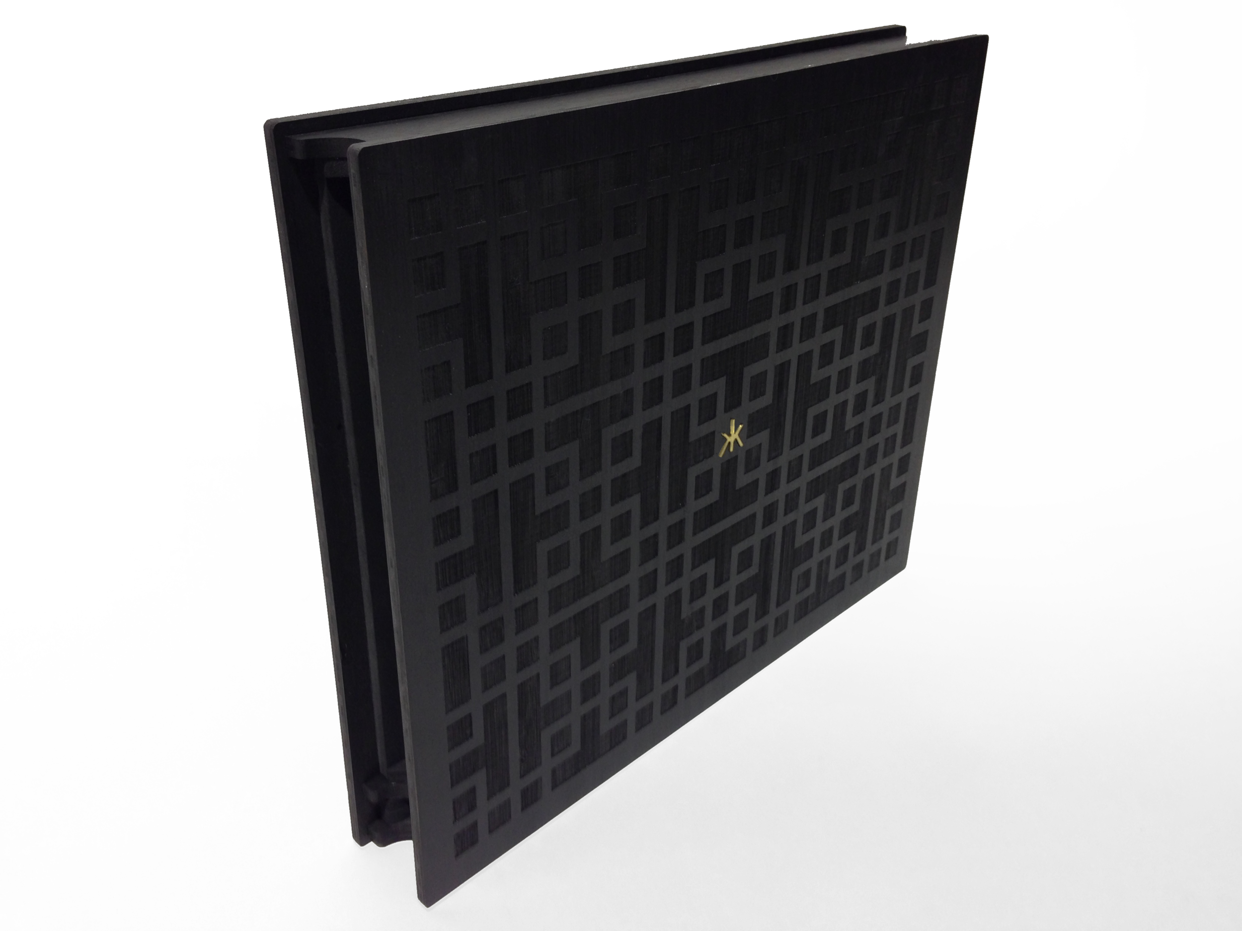 The case is made from bamboo plywood that has been etched with a CNC laser cutter.