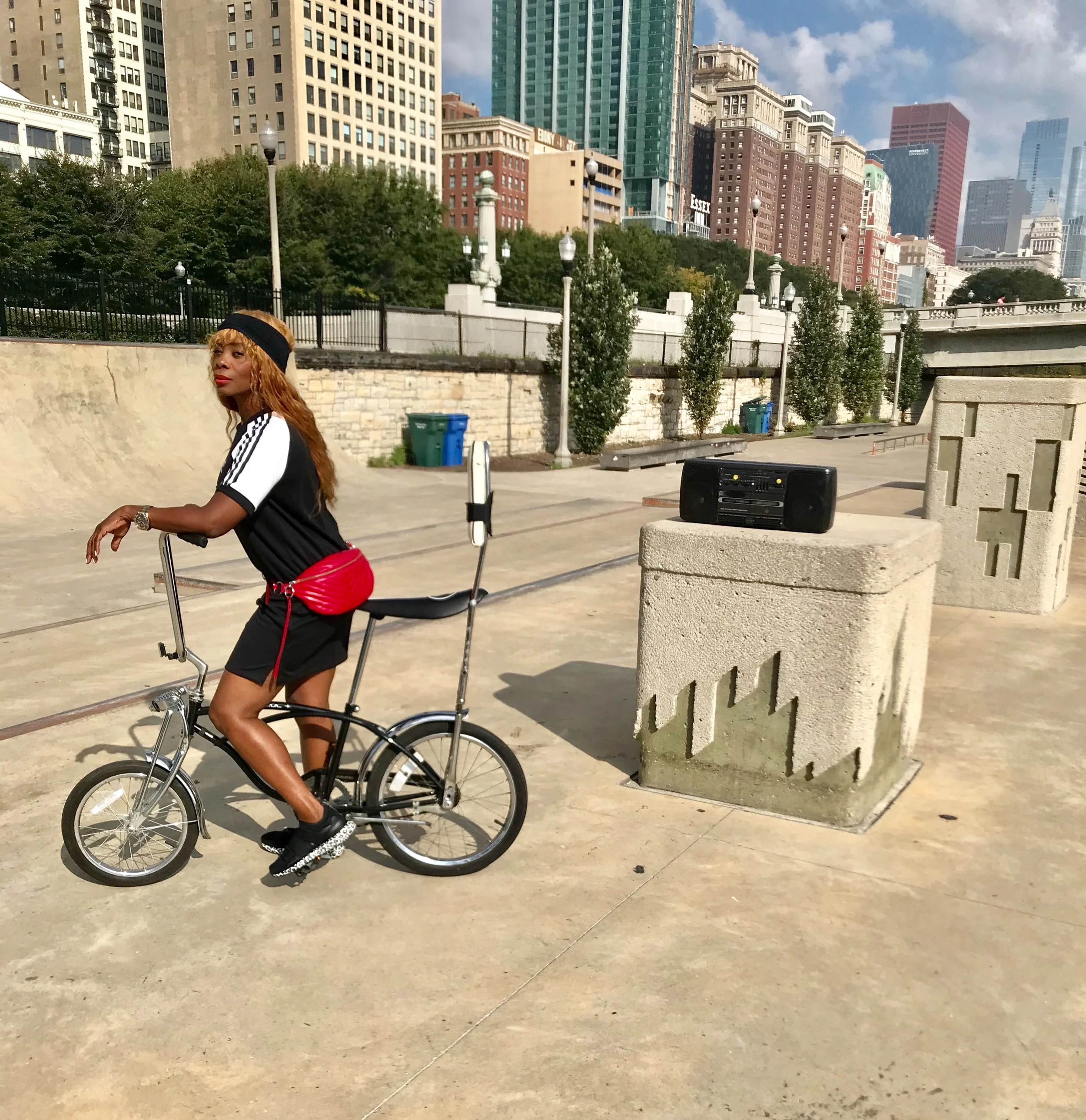 Adidas sport dress with Stella McCartney for Adidas footwear and Rebecca Minkoff’s scarlet belt bag.