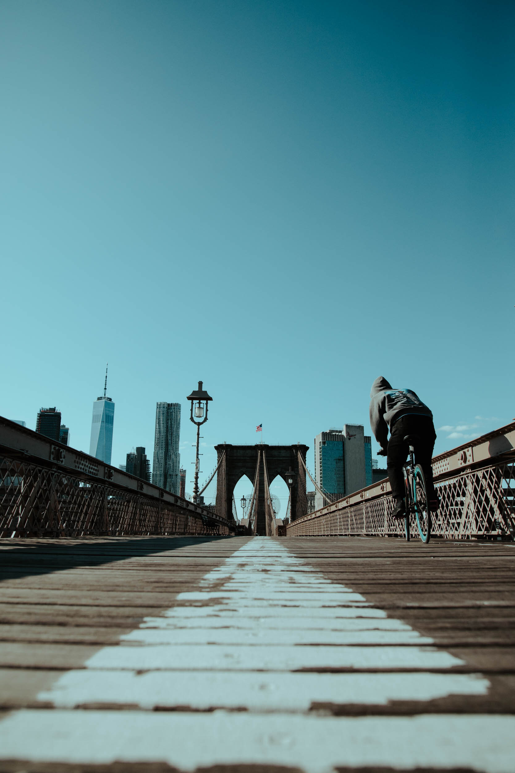  The standard life of a cyclist on the Brooklyn Bridge is crawling at a snail’s pace, dodging and weaving between tourists stood shoulder to shoulder. With foot traffic all but gone, cyclists travel the length of the bridge like a bicycle freeway. 