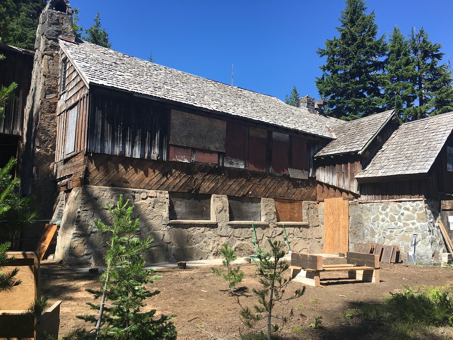 Work is moving forward with these grant funds. The exterior hallway is now off, exposing the beautiful rock foundation.