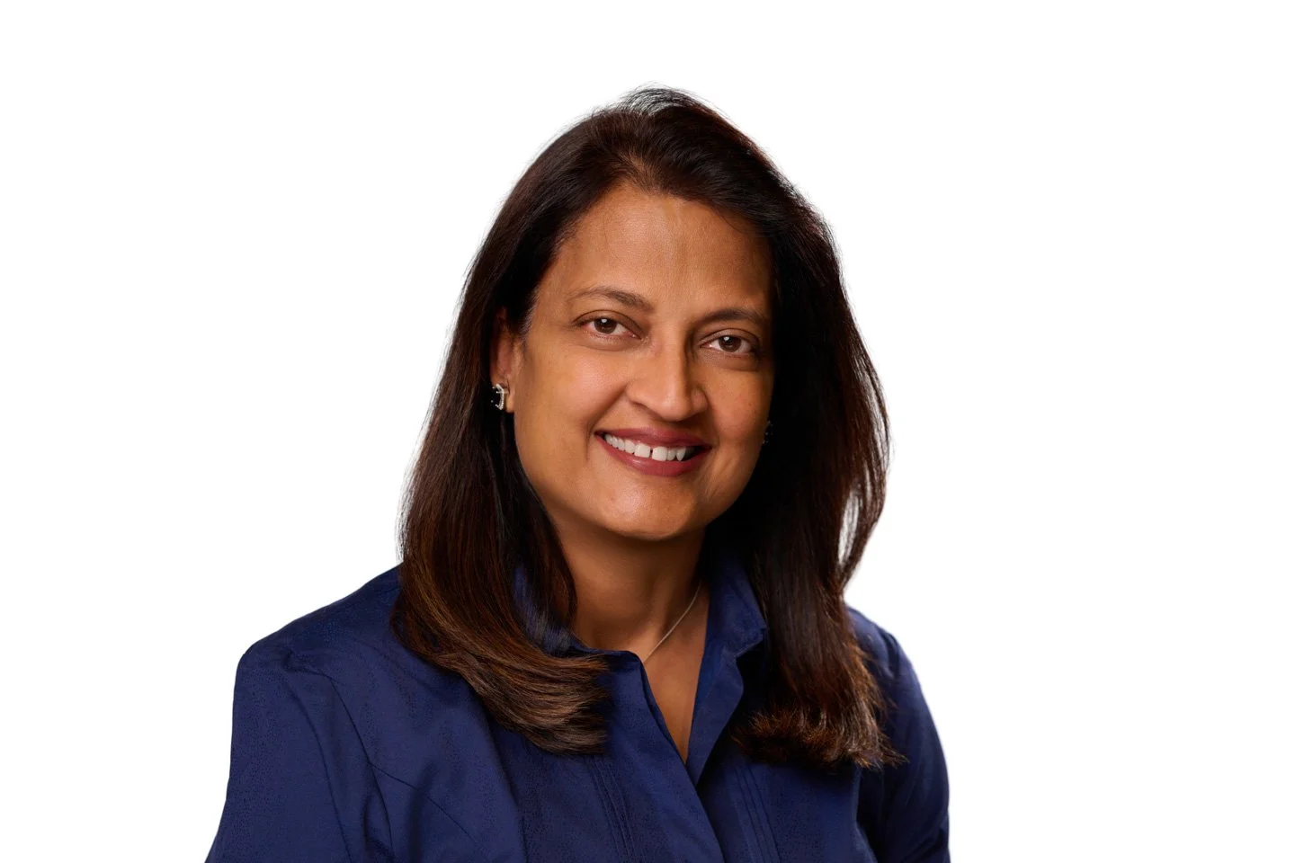 Team headshots taken at a Denver corporate event Headshot Station with a branded backdrop and consistent professional lighting.