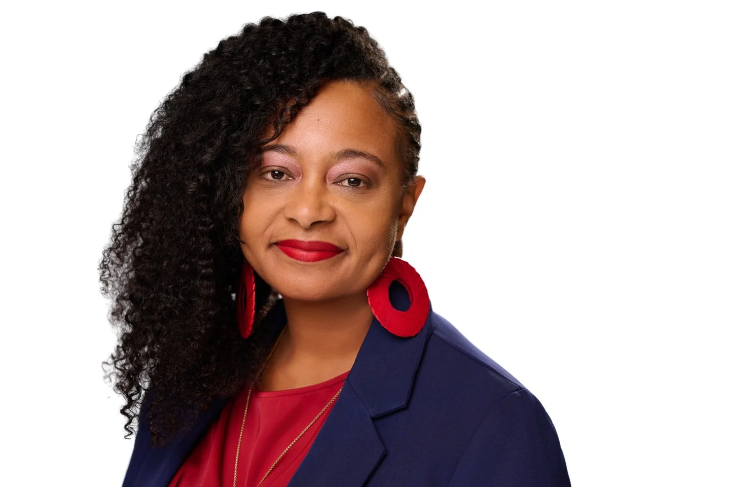 Executive-style professional headshot captured at a Denver conference Headshot Station, featuring studio lighting and neutral background.