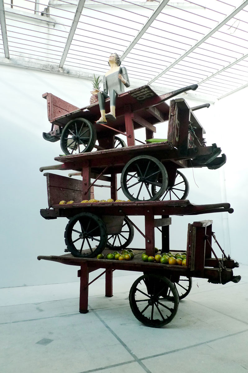   The Virgin Mary of Medellin , 2011 wooden carts, painted wood mannequin, and fruit 103.5 x 83.5 x 36" 
