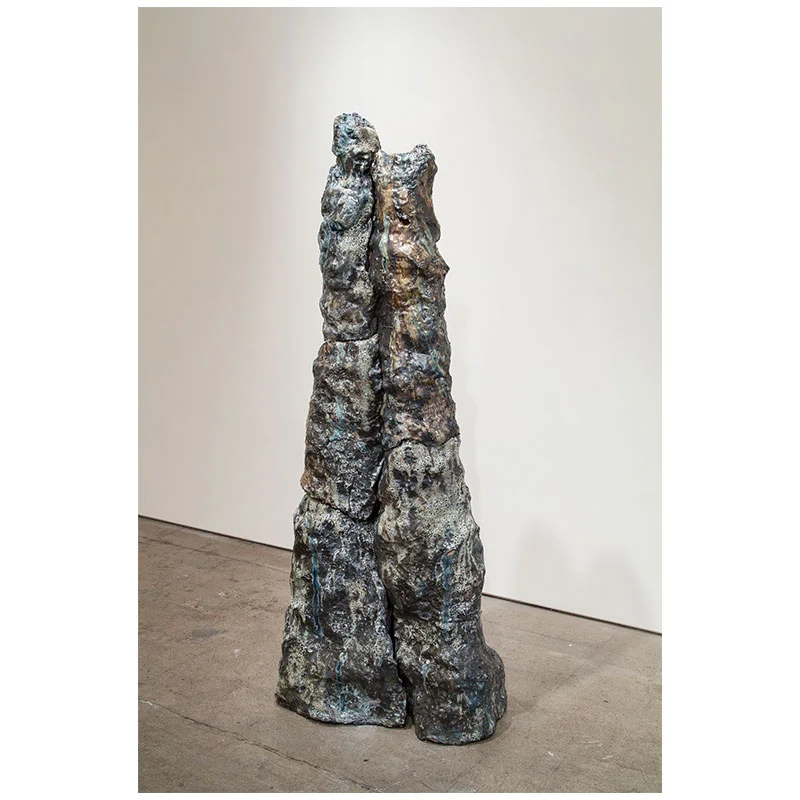 Brad Mildrexler Bonding , 2014 clay glazed with basalt rocks, glass and black glaze 78 x 24 x 17"