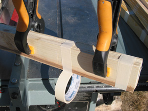  Next the wood flats are clamped together in bundles of 6. There will be some width variations, but have one edge be flush across its surface (the photo shows the bottom edge being made flush).  It is helpful to select a pair of wood flats that are f