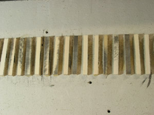 Here the higher ties have been reduced and I'm getting closer to a uniform tie height. It is important to keep the sander level as you along lest the ties become rounded on their ends, or the entire section is at a bevel (an undesirable form of super-elevation).