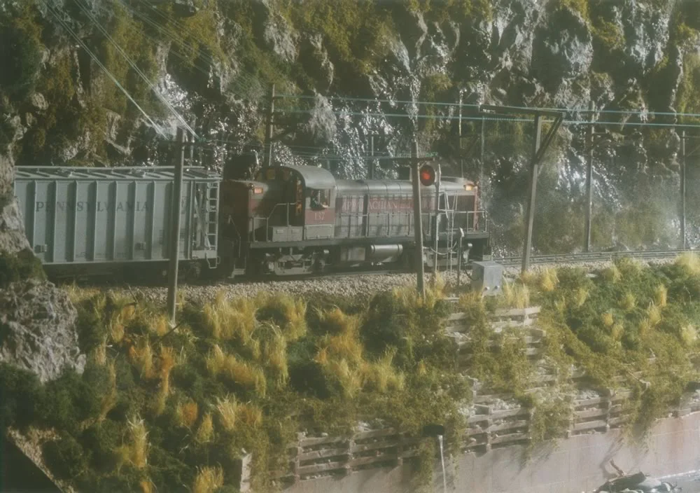 A&O RS3 #137 leads Walden Turn out of Post Tunnel and into the gorge late on a rainy afternoon toward Bayfield.