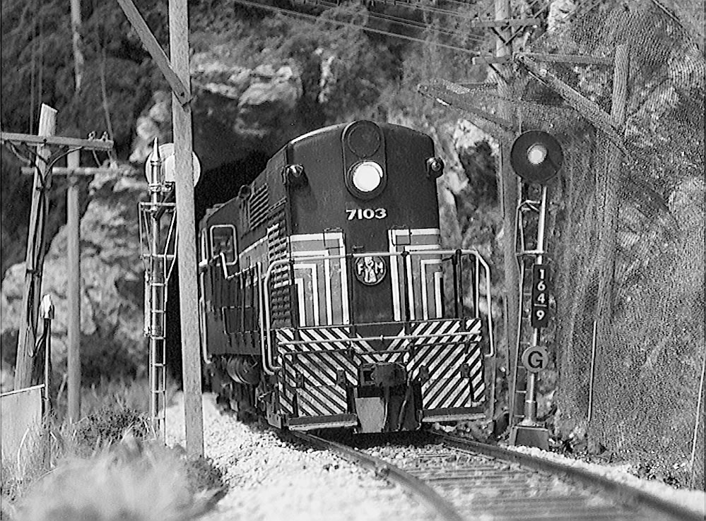  NYC H-20-44 #7103 exits Post Tunnel Northbound with the Penn-Central Transfer. 