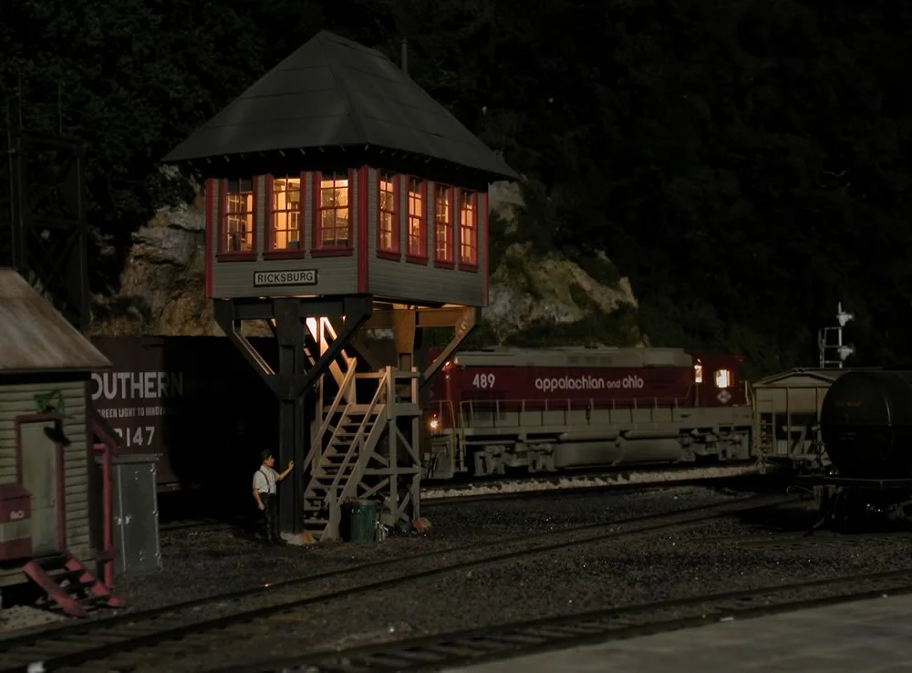 The Ricksburg yard man is working long hours finishing up paper work on a sultry summer evening.
