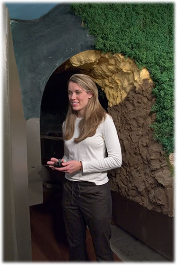  Daughter Kari Stewart stands near the "Kari People Tunnel" that leads to the rainy town of Walden Spring. It was Kari's idea to pierce the mountain ridge with an operator passage-way. 