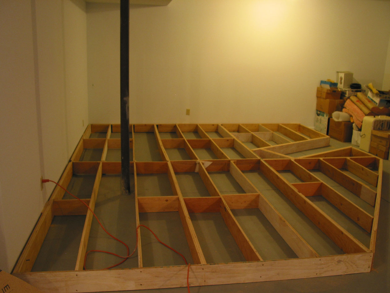  The mailnline here reaches 61", so a raised floor is necessary to keep operations at a reasonable height. A 6" high framework of ripped plywood was anchored to the walls and glued to the floor. 