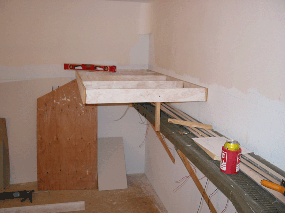  Framing in the "rain room" at Ridge begins. The narrow shelf below Ridge has 3 tracks which are extensions of the King Coal loading tracks in Brooks. With the elevated floor, track at Ridge is 52" for operators. 