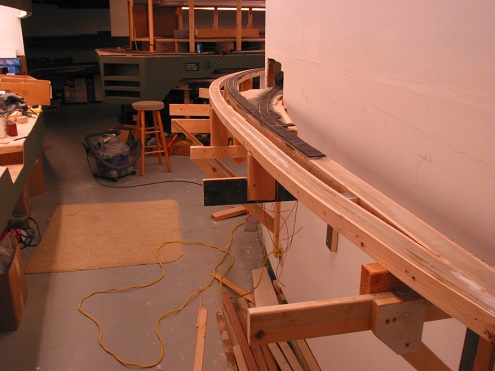  The completed roadbed at Rock Bottom. The siding drops to a lower grade as it paralells the main through Mt. Union around the curve. The wood spline can flex in a smooth vertical curve to nicely accomplish this prototypical look. Departing the main 