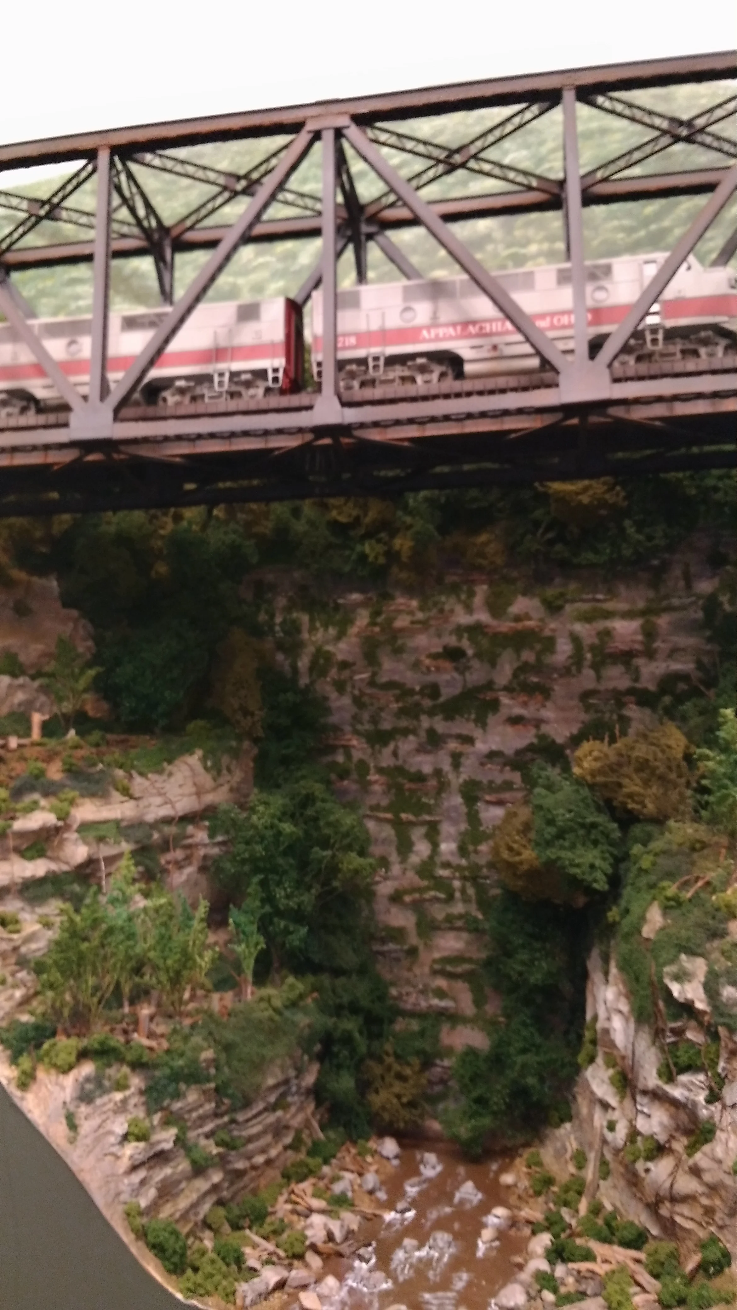 Seen from the riverbed, it's not hard to see why crews call this "Georgeous Gorge". To help with the 3-D effect on the rear wall, I glued small rock sections of plaster onto the wall and then blended them with paint and vines.