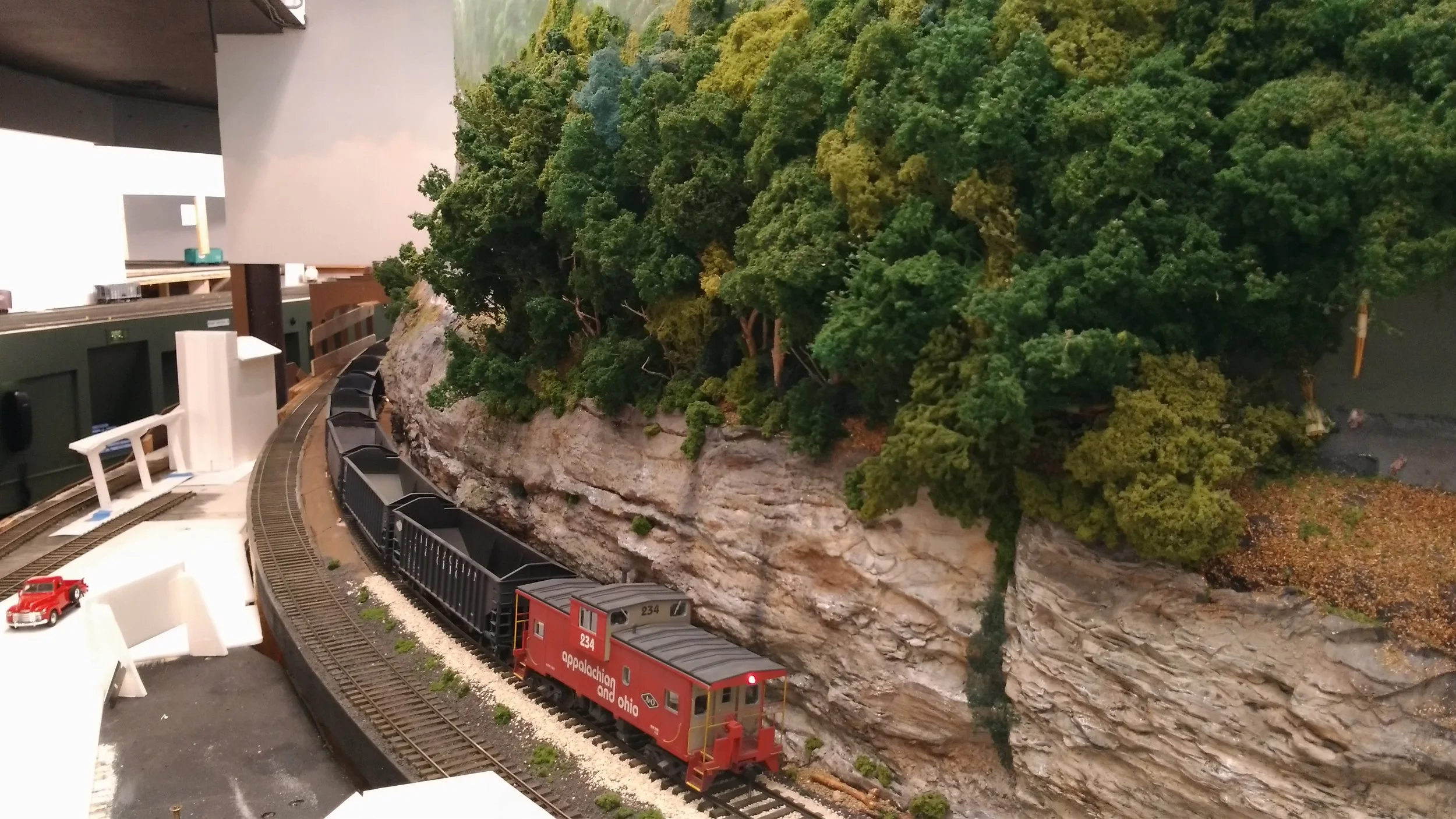 We've overtaken a string of A&O empties. The A&O and A&D will share a multi-level station as seen by the mock-up. We'll follow this train for awhile.