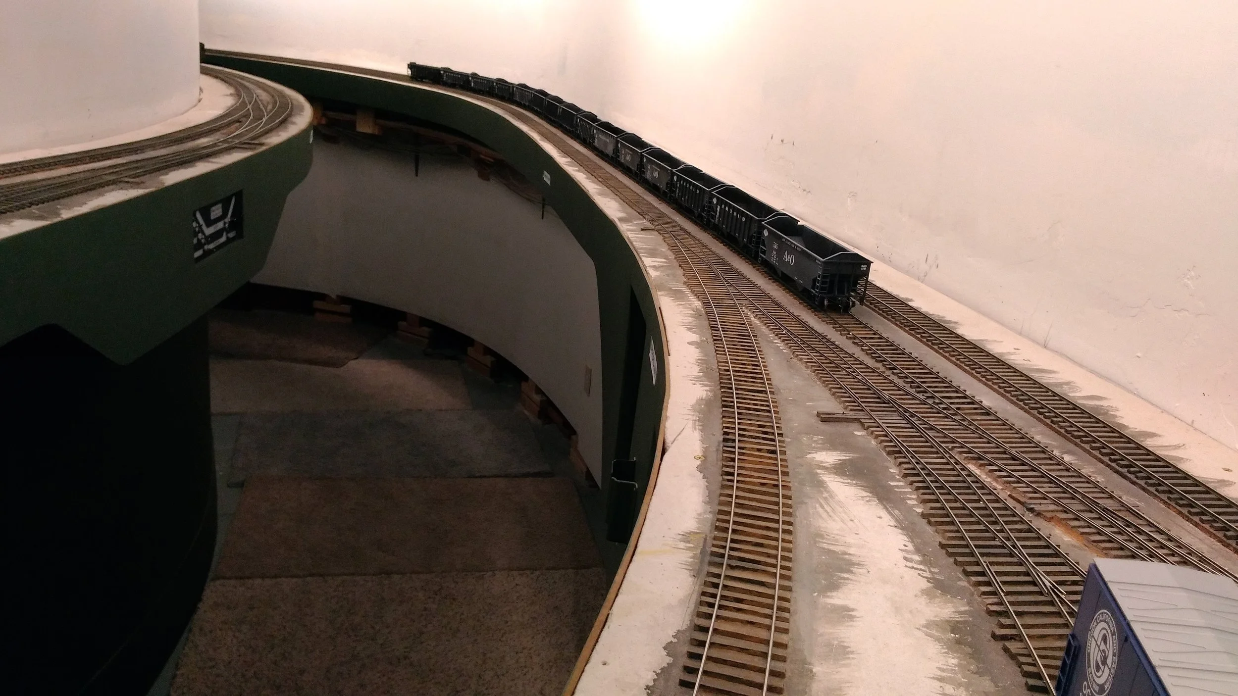 The small Kayford yard, but long enough to allow entire trains to be held or pass as needed. King Coal Jct. on the left begins the passing track, which ends several feet past the last hopper in the distance. These tracks often hold cars waiting to move to/from the mines.