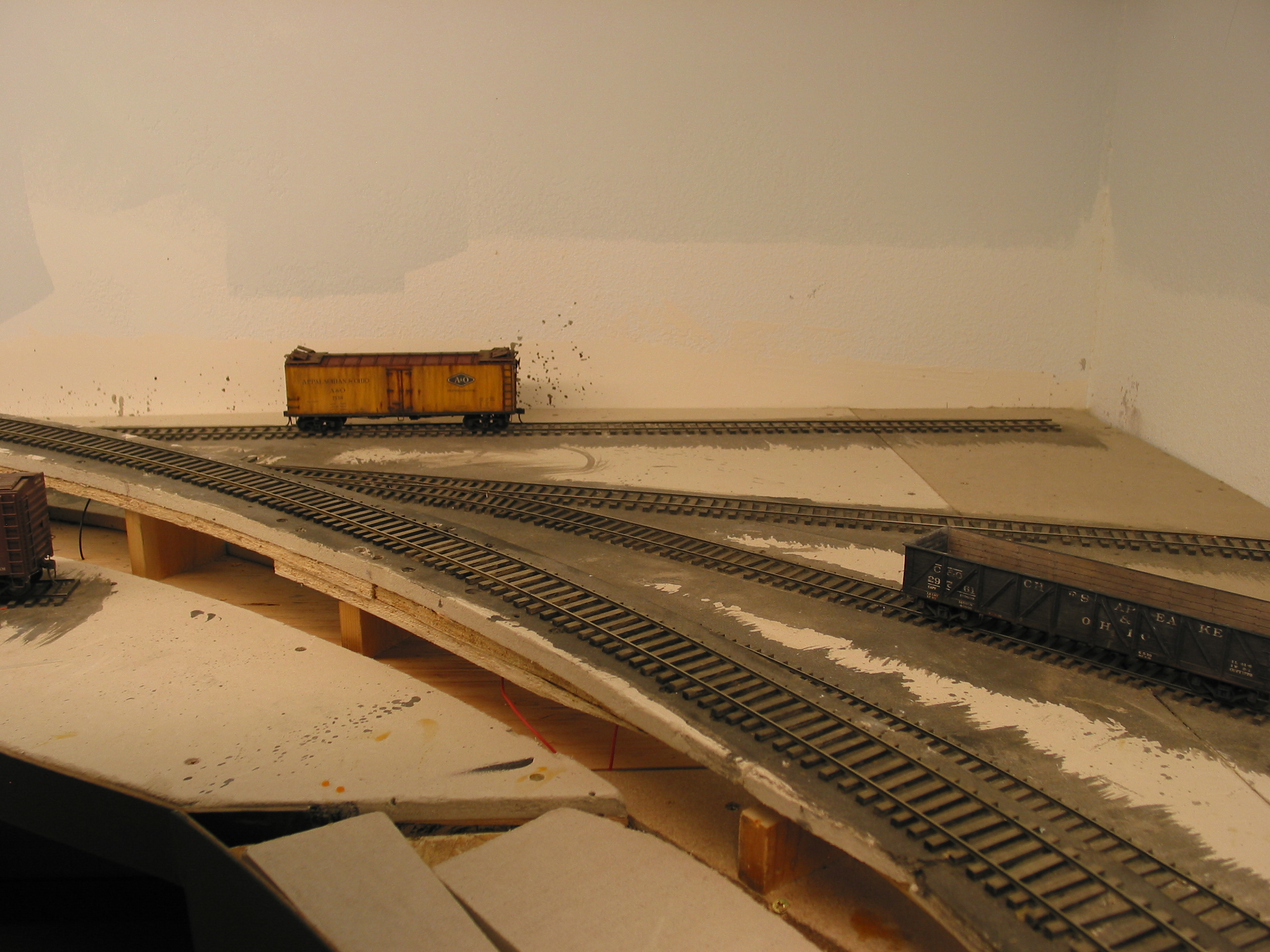  A lone reefer sits along the future ice dock while a gon sits on the loading track for the American Boiler Co. Removable inbound sheet metal loads and outbound boilers will require the switch crew to play put-'n-take with the car loads. 