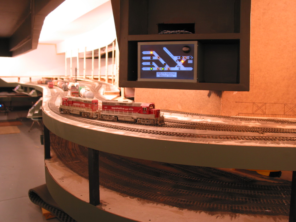  The South Havens yard panel has been installed to control the ladder below. The shelf above is for the CM Tower panel with its trackage just to the right. The bottom edge of this glorified skyboard/lightblock will be hidden by cross-track piping and